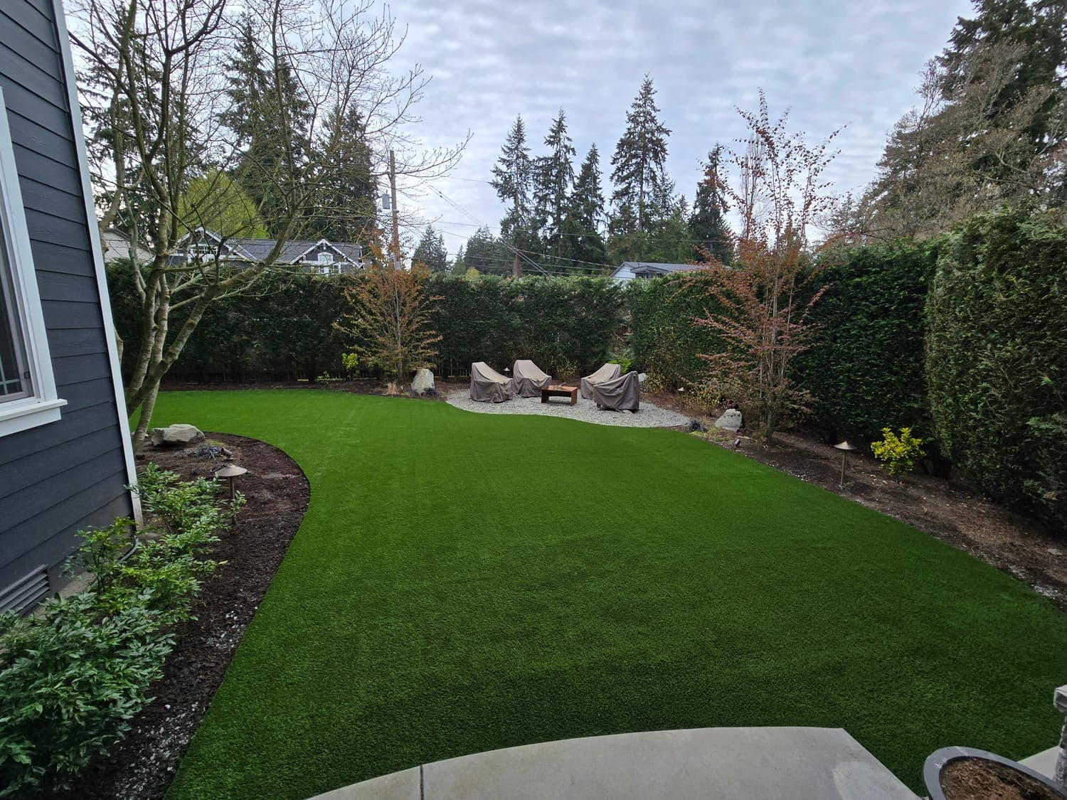Classic backyard lawn installation with natural-looking artificial turf